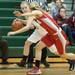 Dexter's Riley McDonald drives the ball down court against Canton during the first half the regional semifinal game at Novi High School Tuesday, Mar. 5th.
Courtney Sacco I AnnArbor.com  